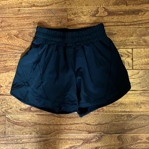 Black Lululemon lined shorts, size four, never worn!